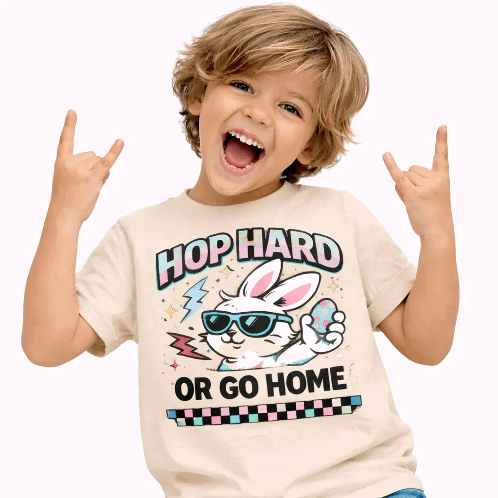Hop Hard or Go Home Kids Easter T-Shirt- neutral featuring a cool bunny graphic and playful design on a child.