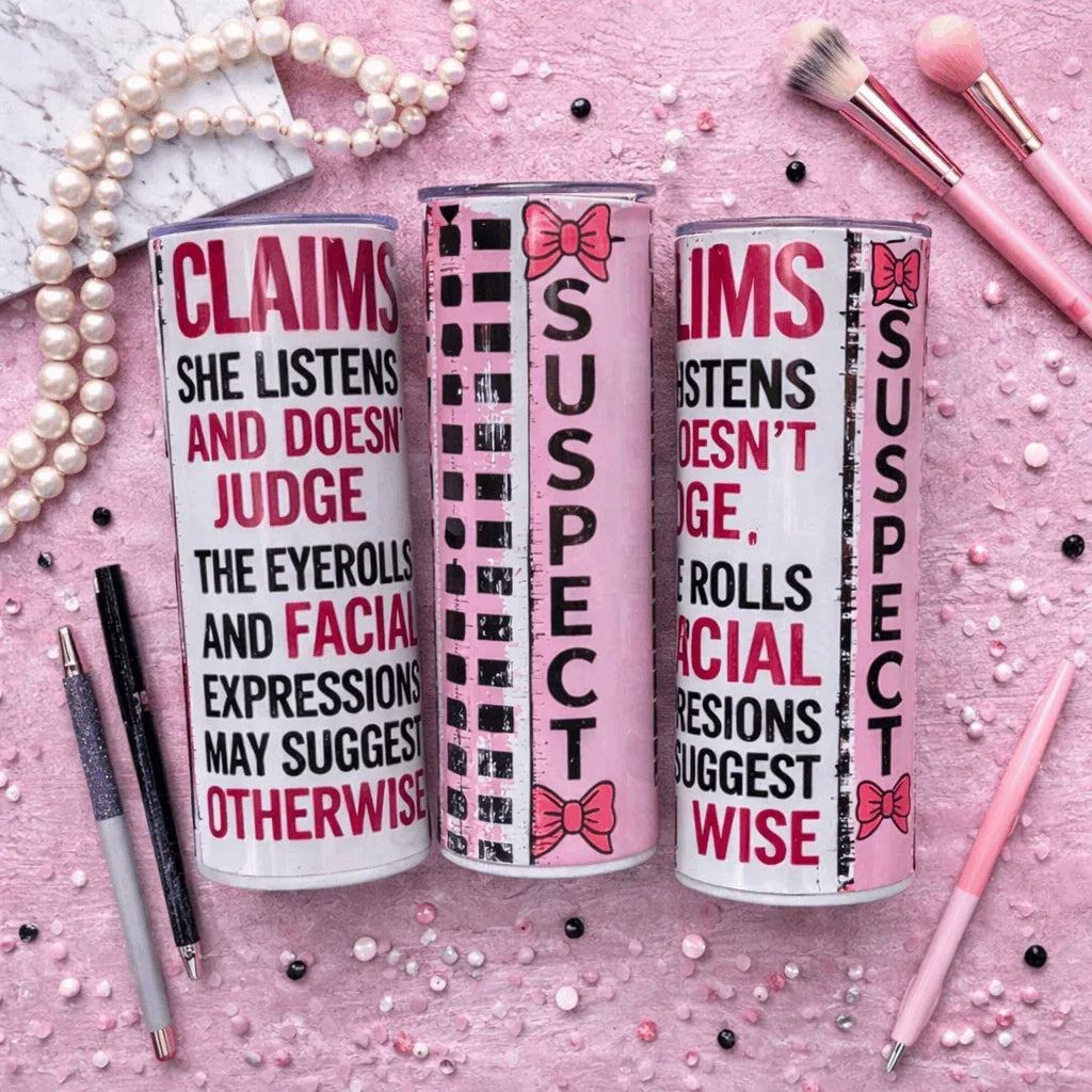 Claims she listens and doesn’t judge 20oz skinny tumbler with pink bow suspect design and funny quote