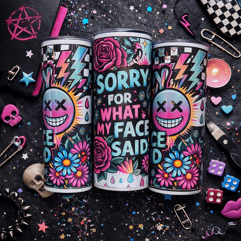 “Colourful 20oz skinny tumbler with ‘Sorry For What My Face Said’ quote, neon smiley face, lightning bolts and floral tattoo design.”